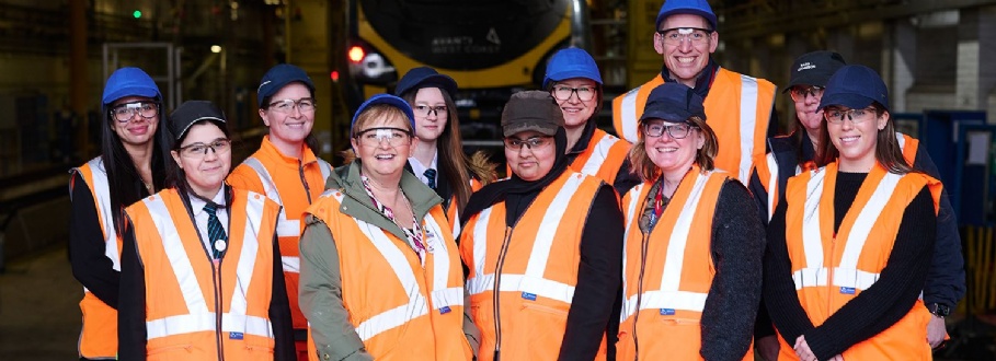 Students in high-vis vests visiting Manchester Traincare Centre on International Women’s Day